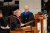 08/5/06 - President Dockery presents Carl E. Zylstra, president of Dordt College, with a plaque of appreciation prior to his commencement address at summer graduation.