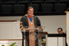 Keith Absher, dean of the McAfee School of Business Administration, reads the names of graduates during summer graduation. - Photo by Morris Abernathy