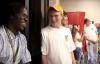 Kennedy Ogwambo and Joseph Ball get to know one another at the open mic night during New Student Orientation. - Photo by Kyle Kurlick