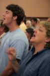 Peter Boedeker and his mother Debbie join other families in a time of worship during the New Student Orientation family chapel. - Photo by Kyle Kurlick