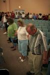 Parents, current students and faculty surround the new students and pray over their Union experience during the family chapel of New Student Orientation. - Photo by Kyle Kurlick