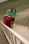 Candace Cross, junior nursing major, helps the freshmen with the move in process. Many upperclassmen helped with the unloading of the cars.                                 - Photo by Heather Phillips
