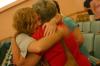 Admist the many tears from family members, Danielle Blackstone was still able to maintain a smile as she gives those closest to her hugs. - Photo by Stephanie Schroeder