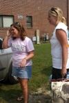Kirby Russ, from Killen, Ala., takes a moment to laugh with Beth McDowell as they unload the last of her stuff from the car. - Photo by Stephanie Schroeder