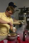 Seniors Rhett Barker and Nate Eckley, both chemistry majors, mix and serve some nitrogen ice cream to students during lunch in the PAC hallway. They served both chocolate and strawberry. - Photo by Stephanie Schroeder