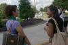 Lydia Livingston talks with freshman Kimberly Middleton, from Olive Branch, Tenn., while they wait on rides to tour Jackson during New Student Orientation. - Photo by Stephanie Schroeder