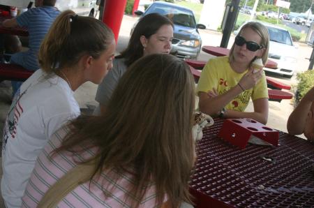 Laura Crittendon and Jenny Emmanuel enjoy some ice cream from Sonic and listens to Lauren Crane as she tells stories of her time thus far at Union during New Student Orientation.