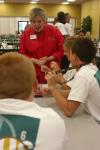 Lanese Dockery takes the opportunity to meet and talk to Stephen Williams, Ryan Davis and Bethany Anderson, all from Louisville, Ky., at the ice cream party during New Student Orientation. - Photo by Stephanie Schroeder