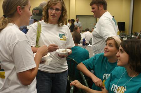 Kayla Clary, Amanda Pennington and Erin Brassart fellowship with Rachael French (left) at the ice cream social during New Student Orientation.