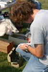 09/8/06 - Junior Nathaniel &ldquo;Squirrel&rdquo; Brewer records items sold at a yard sale he and other students set up in front of McAfee commons.