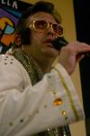 Gavin Richardson, associate professor of English, acts as an Elvis impersonator on a special night at Moe's where he belted out the song &ldquo;My Way.&rdquo; - Photo by Stephanie Schroeder