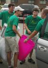Kyle Clark, Nathan Sing, Bob Sparks and Tyler Glodjo have fun as they help freshmen move in during New Student Orientation. - Photo by Matthew Diggs
