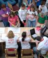 Residence directors check in new students on move in day during New Student Orientation. - Photo by Matthew Diggs