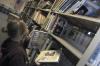 Freshman Pamela Penrose, psychology major, puts up some books in the library at Jackson Central-Merry High School during her Day of Remembrance project.    - Photo by Heather Phillips