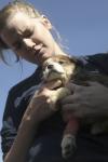 Debra Howell loves on this puppy with an injured leg at the Madison County Humane Society during Day of Remembrance. - Photo by Kyle Kurlick