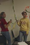 Freshmen Bethany Anderson and Chanel Watson decorate Evangelical Community Church in Jackson on the Day of Remembrance. - Photo by Holly Gushee