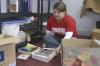 Sophomore Anna Townsend sorts through materials and organizes them for better storage at Iglesia Bautista Hispania Church located at Poplar Heights Baptist Church during Day of Remembrance. - Photo by Stephanie Schroeder