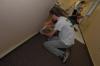 Senior Brad Spencer preps the wall before painting at Birth Choice during Day of Remembrance. - Photo by Morris Abernathy