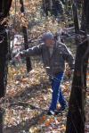 Dr. James Huggins goes off the boardwalk to pick up trash at Cypress Grove during Day of Remembrance. - Photo by Morris Abernathy