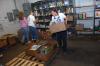 Alpha Psi Omega students help organize cans at RIFA during their Day of Remembrance project. - Photo by Morris Abernathy