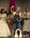 Sara Chinery as Little Bo Peep, Trevor Yarbrough as Old King Cole and Natalie Newberry as Cinderella, assist Marcellus the Pig, played by Kali Wagner, by becoming the house of straw in <em>The Trial of the Big Bad Wolf</em>. - Photo by Kyle Kurlick