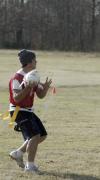 Sophomore Josh Abbotoy looks to make a pass with the frozen turkey during the annual Turkey Bowl. - Photo by Holly Gushee