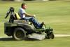 Matt Brasfiled rides a John Deere zero-turn mower around Dement Drive. Riding mowers are used to cover hundreds of acres every week.  - Photo by Matthew Diggs