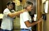 Matt Brasfield congratulates Robert Cox, director of the grounds crew, at the close of a work day capping off eight full hours of work in the hot Tennessee sun. - Photo by Matthew Diggs