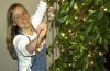 11/27/06 - Senior Katie Watson, ESL major, helps the McAfee commons get in the Christmas spirit by hanging up some lights during a Christmas decorating party.