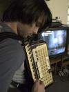 11/18/06 - Cody Curtis serenades his McAfee roommates as they play video games. 