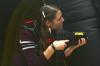Nikki Fritts looks for ways to gain points in a laser tag game held in the small gym during Frost Fest put on by SAC. - Photo by Stephanie Schroeder