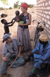 Sophomore April Bermudez holds one of the children while fellowshipping with members of the village.  From the <i>Unionite</i> feature: <i>They Came to Join In</i> - Photo by Warren Johnson