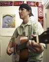 11/16/06 - John Hawley enjoys strumming his guitar for his McAfee roommates to hear. 