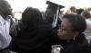 12/16/06 - Andrew Harvey, master of arts in education graduate, greets friends and family following fall graduation. - Kyle Kurlick
