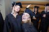Michelle Lawrence, English graduate, and Heather Phillips, art graduate, ham it up before the fall graduation ceremony. - Photo by Morris Abernathy