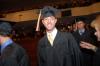 Joel Polk, management graduate, enters his row at the beginning of fall graduation. - Photo by Morris Abernathy