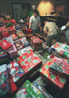 11/18/02 - The men of Alpha Tau Omega organize shoeboxes filled with toys and essential items for their Operation Christmas Child drive.
