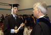 Christian Studies major Will Cherry from Germantown, TN talks with professor Mark Dubis as graduates begin to organize just before Union's December graduation ceremony. - Photo by Jim Veneman