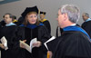 Biology faculty members Carol Weaver and James Huggins prepare for Union's December graduation ceremony. - Photo by Jim Veneman