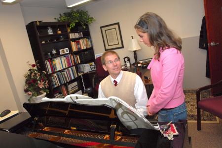 David Dennis, professor of music, works with Ellen Carrington during a private lesson.