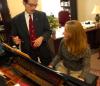 Ron Boud, professor of music, works with Kate Rawls during a keyboarding lesson. - Photo by Morris Abernathy
