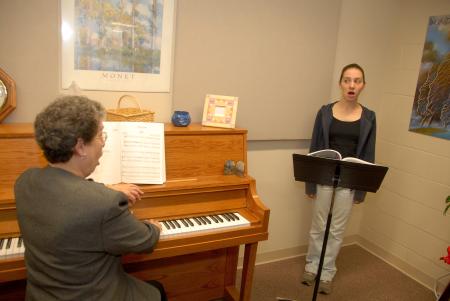 Betty Bedsole, professor of music, works with Sara Chinery during a singing lesson.