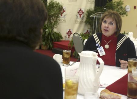 Carla Reeves of West Tennessee Healthcare engages in conversation before the ninth annual Union Forum.