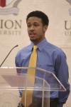 Junior Edric Gaylor presented a selection from Dr. Martin Luther King, Jr. during the First Annual Black History Month Program. - Photo by Wayne Holmes