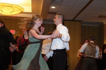 Senior Nathan Cobb twirls Sophomore Jessica Gillard during the Swing Dance put on by SAC at the Andrew Jackson Ballroom of the Double Tree Hotel.
