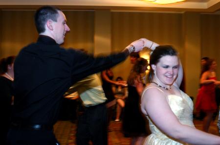 Senior David Roach twirls Liz Hand around during SAC's Swing Dance at the Andrew Jackson Ballroom of the Double Tree Hotel.