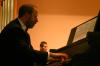 Terry McRoberts accompanies the Union Symphonic Band on the piano during the end of the semester concert. - Photo by Stephanie Schroeder