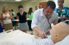 In the Nursing department's new home on the second floor of White Hall, Jason Hooper uses a stethoscope to hear a simulator's breathe during a demonstration of the department's new features. - Photo by Kyle Kurlick