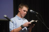 <i>Faith in Practice Conference:</i> Christian Studies major Brandon James reads scripture before Dr. Whitney presented his message. - Photo by Jim Veneman