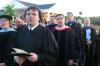 SGA President Josh Clarke sings the Union University Alma Mater along with the faculty at the end of graduation. - Photo by Stephanie Schroeder